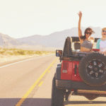 Two travelers enjoying a jeep ride through the Moroccan desert
